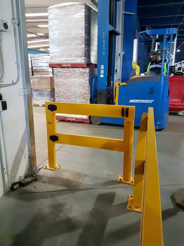 Verge barrier protecting a doorway in a freight facility