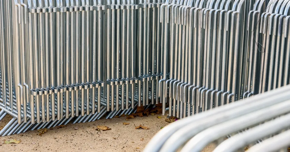 Stacked metal crowd control barriers outdoors