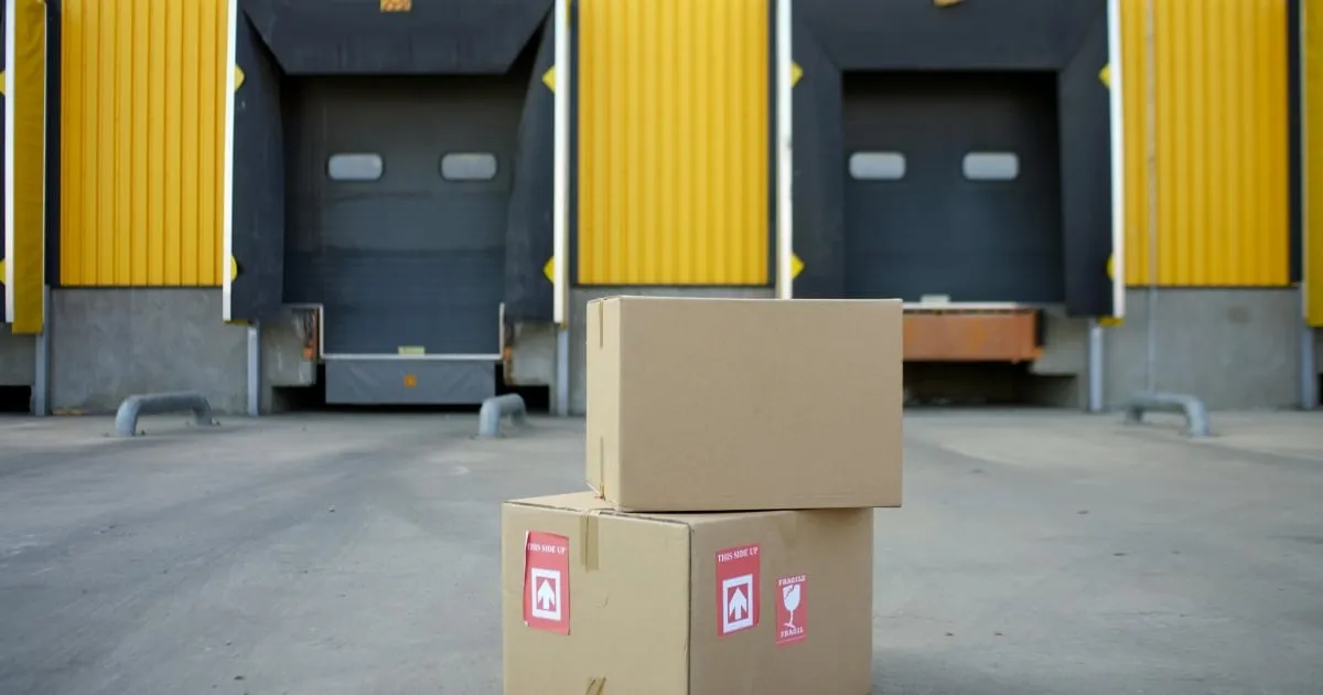 Stacked cardboard boxes at warehouse loading dock