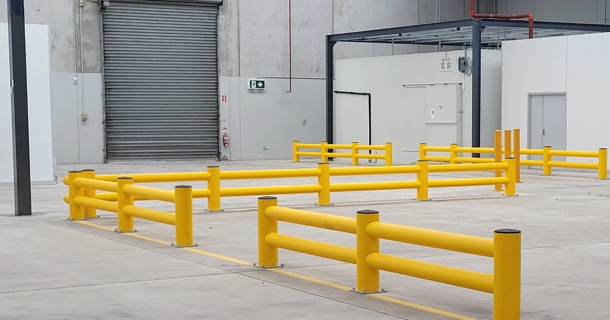 Yellow safety barriers inside industrial warehouse