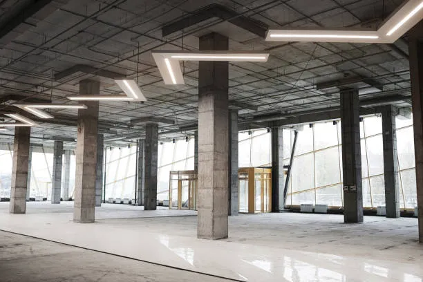 An interior view of a large, modern building under construction