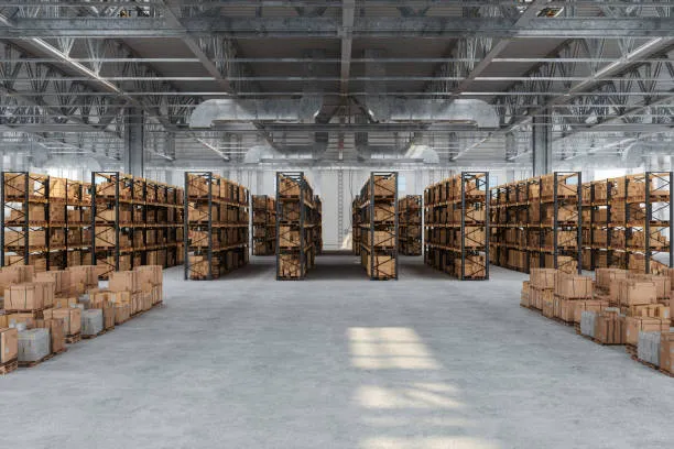 An expansive view of a large, organised warehouse interior with high ceilings
