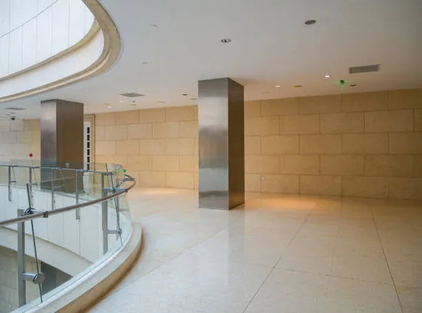 Modern interior corridor with curved glass railing