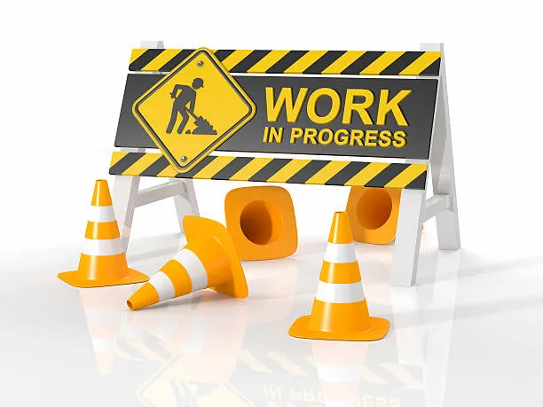 A 3D digital illustration of a 'WORK IN PROGRESS' safety barrier with yellow and black hazard stripes