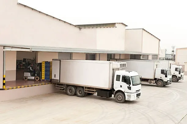 Trucks loading at warehouse dock