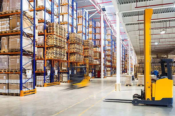 Large warehouse with pallet racks and forklift